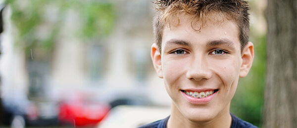 Teenager with metal braces at Blackburn Orthodontics
