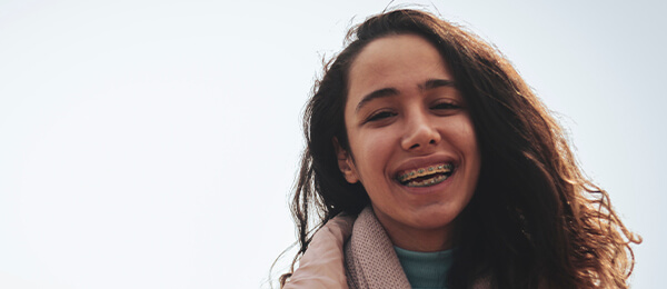 Teenager with braces at Blackburn Orthodontics