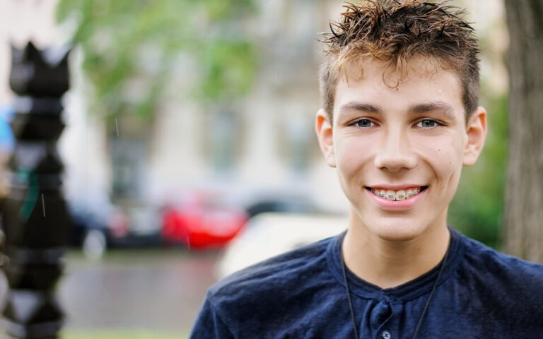 Teenager with metal braces at Blackburn Orthodontics